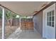 Covered patio featuring bar seating area with view of wooden fence and mature trees at 512 N Ironwood --, Mesa, AZ 85201