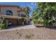 Backyard view of the covered patio and second story exterior showing the neutral color palette at 533 N Cobblestone St, Gilbert, AZ 85234