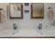 Double vanity bathroom with decorative mirrors and black hardware at 533 N Cobblestone St, Gilbert, AZ 85234