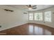 Large bedroom featuring wood floors, ample windows and recessed lighting at 533 N Cobblestone St, Gilbert, AZ 85234