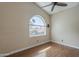 Vacant bedroom showing hardwood floors, neutral paint, and window view at 533 N Cobblestone St, Gilbert, AZ 85234