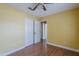 Spacious bedroom featuring wood floors, closet and view of an adjacent bedroom at 533 N Cobblestone St, Gilbert, AZ 85234