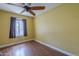 Bedroom featuring laminate flooring and a window with a view of the yard at 533 N Cobblestone St, Gilbert, AZ 85234