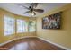 A bedroom featuring hardwood floors and bay windows at 533 N Cobblestone St, Gilbert, AZ 85234