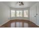 A bedroom has multiple windows providing natural light and a connecting door at 533 N Cobblestone St, Gilbert, AZ 85234