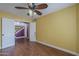 Bedroom with wood floors, and a staircase outside the doorway at 533 N Cobblestone St, Gilbert, AZ 85234