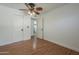 Bedroom featuring hardwood floors, a ceiling fan and access to other rooms at 533 N Cobblestone St, Gilbert, AZ 85234