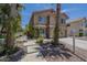 Inviting home exterior with a pathway, mature trees, and desert landscaping at 533 N Cobblestone St, Gilbert, AZ 85234