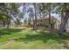 Charming two-story home featuring mature trees, lush green vines, and well manicured grounds at 533 N Cobblestone St, Gilbert, AZ 85234