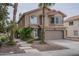 Charming two-story home featuring a two-car garage, desert landscaping, and a red tile roof at 533 N Cobblestone St, Gilbert, AZ 85234