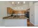 Bright kitchen with granite countertops, a breakfast bar, and stainless-steel appliances at 533 N Cobblestone St, Gilbert, AZ 85234