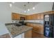Kitchen area featuring modern appliances and granite countertops at 533 N Cobblestone St, Gilbert, AZ 85234