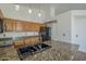 Kitchen with granite countertops and stainless steel appliances at 533 N Cobblestone St, Gilbert, AZ 85234
