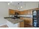 Kitchen featuring granite countertops, ample cabinet space, and black appliances at 533 N Cobblestone St, Gilbert, AZ 85234