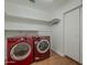 Laundry room with modern front loading washer and dryer at 533 N Cobblestone St, Gilbert, AZ 85234