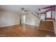 Spacious living room featuring beautiful wood floors and staircase at 533 N Cobblestone St, Gilbert, AZ 85234