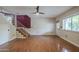View of the living room with wood floors and a staircase at 533 N Cobblestone St, Gilbert, AZ 85234