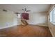 Bright living room with wood floors and staircase at 533 N Cobblestone St, Gilbert, AZ 85234