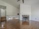 Open living room with a fireplace and stairs to the second floor at 533 N Cobblestone St, Gilbert, AZ 85234