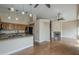 Spacious living room featuring hardwood floors, ceiling fan, and a cozy fireplace at 533 N Cobblestone St, Gilbert, AZ 85234