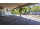 Large covered patio area with brick pavers and lush landscaping at 533 N Cobblestone St, Gilbert, AZ 85234