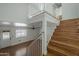 Staircase with hardwood steps and white railing, leading to the upper level at 533 N Cobblestone St, Gilbert, AZ 85234