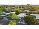 Aerial view of a neighborhood showcasing well-maintained homes, mature trees, and lush landscaping at 5714 N 11Th St, Phoenix, AZ 85014