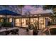 Charming brick backyard patio with outdoor dining, mature shade trees, and stylish lounge area at 5714 N 11Th St, Phoenix, AZ 85014
