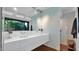 Modern bathroom with a dual sink vanity and frosted glass shower at 5714 N 11Th St, Phoenix, AZ 85014