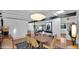 Modern dining room with contemporary lighting, brick accent wall, and open floor plan at 5714 N 11Th St, Phoenix, AZ 85014