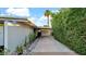 Driveway leading to a carport, landscaped with desert plants and decorative rocks at 5714 N 11Th St, Phoenix, AZ 85014