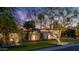 Well-lit front yard with lush lawn, desert landscaping, and a modern architectural design at 5714 N 11Th St, Phoenix, AZ 85014