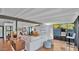 Open-concept living space with beams, a modern sofa, and seamless indoor-outdoor living at 5714 N 11Th St, Phoenix, AZ 85014