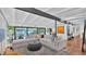Bright and spacious living room with modern sectional, beamed ceiling, and large sliding glass doors at 5714 N 11Th St, Phoenix, AZ 85014