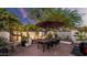 Charming brick patio with outdoor dining set, desert plants, and ambient lighting at 5714 N 11Th St, Phoenix, AZ 85014