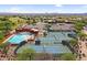 Aerial view of community amenities including a pool, tennis courts, and parking at 6145 E Snowdon St, Mesa, AZ 85215