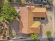 A home's roof is adorned with red tiles, complemented by desert landscaping, and a private backyard setting at 6145 E Snowdon St, Mesa, AZ 85215
