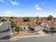 A desirable neighborhood showcases a single-story home with a red tile roof, an attached garage, and desert landscaping at 6145 E Snowdon St, Mesa, AZ 85215