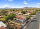 Aesthetic aerial view of residential community with mountain backdrop, showcasing neighborhood layout at 6145 E Snowdon St, Mesa, AZ 85215