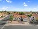 Charming single-story home with an attached two-car garage, desert landscaping, and a distinctive red tile roof at 6145 E Snowdon St, Mesa, AZ 85215