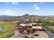Expansive aerial view of community clubhouse, golf course and desert mountain backdrop at 6145 E Snowdon St, Mesa, AZ 85215