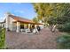 Backyard patio area with comfortable outdoor furniture, desert landscaping, and a covered patio at 6145 E Snowdon St, Mesa, AZ 85215