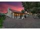 Spacious backyard with a covered patio, string lights, and desert landscaping at 6145 E Snowdon St, Mesa, AZ 85215