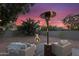 Relaxing backyard with patio furniture, a fire pit, and a heater, perfect for outdoor entertaining at 6145 E Snowdon St, Mesa, AZ 85215