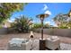 Backyard patio features an outdoor heater and comfortable seating in a landscaped space at 6145 E Snowdon St, Mesa, AZ 85215