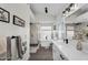 Modern bathroom featuring a soaking tub, walk-in shower, and stylish vanity with marble countertops at 6145 E Snowdon St, Mesa, AZ 85215