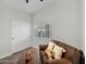 Relaxing bedroom features a comfortable couch, closet and neutral colors at 6145 E Snowdon St, Mesa, AZ 85215