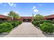 Well-maintained building entrance with landscaped bushes, offering a welcoming and professional atmosphere at 6145 E Snowdon St, Mesa, AZ 85215
