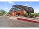 Inviting community building entrance with shade structure, desert landscaping, and nearby parking at 6145 E Snowdon St, Mesa, AZ 85215