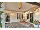 Cozy covered patio with comfortable seating, string lights, and a charming rug at 6145 E Snowdon St, Mesa, AZ 85215